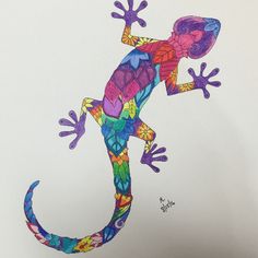 a drawing of a colorful lizard on white paper