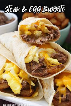 steak and egg burrito on a plate with tater tots in the background