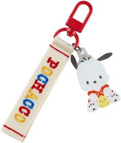 a keychain with a cartoon dog on it and a name tag attached to it