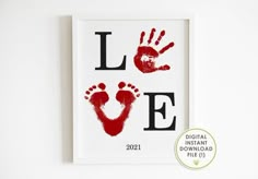 a red hand print with the word love on it