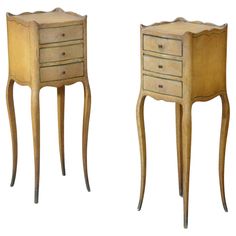 two small wooden tables with drawers on each side, one is turned down and the other has