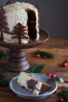 a slice of cake with white frosting on a plate