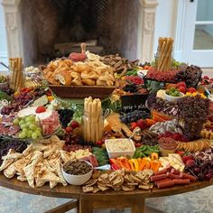 a table filled with lots of different types of food and desserts on top of it