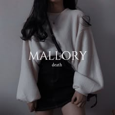 a woman with long black hair wearing a white sweater and black miniskirt, standing in front of a wall