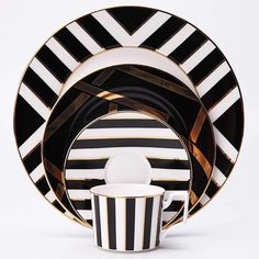 a black and white striped dinnerware set