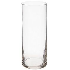 a tall glass vase sitting on top of a white table