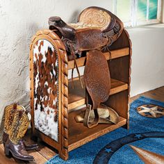 an old western furniture with cowhides and cowboy boots