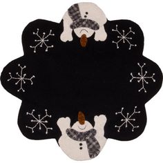 a black and white rug with snowmen on it