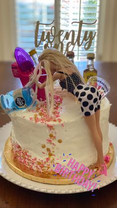 a birthday cake decorated with confetti and decorations