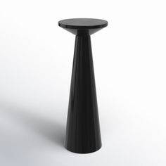 a black table sitting on top of a white floor