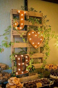 a table topped with lots of food next to a sign that says i love you