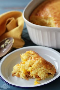 sweet corn spoonbread on a white plate next to a casserole dish and bananas