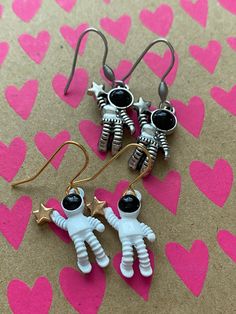 For all you spaced out types these cute little astronaut earrings are a must have! He's hanging onto a star and free floating through space  Measuring 21mm In white with gold plate hooks  Silver coloured metal with surgical steel hooks Will arrive totally gift wrapped just because I love wrapping stuff up and if you're buying as a gift then why not add a personal note and I'll include it 💖 Astronaut Earrings, Floating Through Space, Alien Earrings, Man Earrings, Earrings Star, Shooting Star, Men Earrings, Shooting Stars, Astronomy