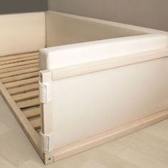 a bed frame that is made out of wood and has no mattresses on it