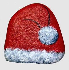 a red and white hat with snow on it