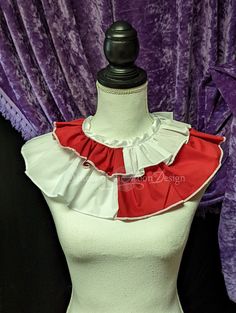 a mannequin wearing a red and white top with ruffles on it