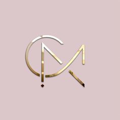 the letter m is made up of gold and silver lines on a light pink background