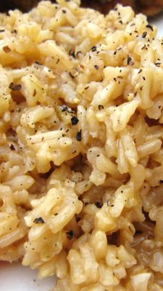 rice with black pepper is on a white plate