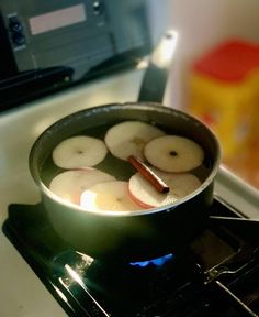 apples are being cooked in a pan on the stove