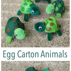 an egg carton animal is sitting on the floor next to other stuffed animals that look like turtles