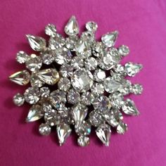 If you love jewelry, you will love this vintage glitzy crystal brooch which is probably from the 50's if not earlier.  It is a weighty, domed pin with clear round and pear shaped crystals that measures about 3 inches in diameter. These stones shine so much that it is hard to photograph them and the photos don't do them justice.  This pin is beautiful, and would look fabulous on a blazer, jacket or coat.        These are great for the vintage collector, or as a gift for someone who loves glitzy j Crystal Glassware Antiques, Antiques Value, Vintage Jewelry Ideas, Shaped Crystals, Vintage Jewelry Crafts, Cameo Jewelry, Beaded Lanyards, Love Jewelry