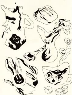 some black and white drawings on paper with different shapes in the shape of animals'heads