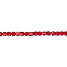 red faceted glass beads on a white background