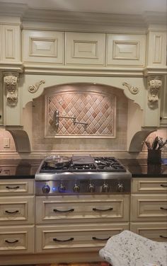 a stove top oven sitting inside of a kitchen