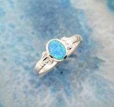 blue opal silver ring, opal ring, Greek ring, dainty ring, Greek jewelry, blue opal ring, opal jewelry, anniversary gift, gift for wife"Sacred Bath" is a silver ring with blue opal. The opal illuminates in the daylight with the most beautiful colors of the Greek sea. This magical stone reminds us of Aphrodite’s sacred bath and symbolizes the amazing rebirth which can be experienced by every woman who returns to the natural source of her inner power.In Paphos, on a beach of the Greek island of Cy Sacred Bath, Most Beautiful Colors, Greek Sea, Opal Silver Ring, Greek Ring, Blue Opal Ring, Magical Stones, Paphos, Inner Power