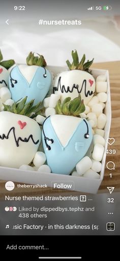 some white and blue strawberries are in a box