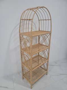 a bamboo birdcage with three shelves on each side