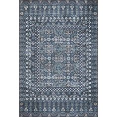 a blue rug with an intricate design on the front and back side, in various colors