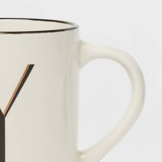 a white coffee mug with the letter y on it