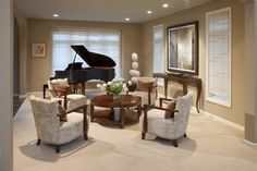 a living room filled with furniture and a piano