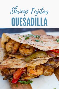 shrimp fajitas quesadilla on a cutting board with text overlay