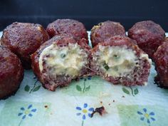 some meatballs with cheese are on a plate