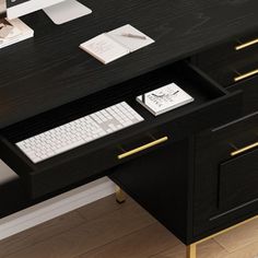 a computer desk with a keyboard and mouse