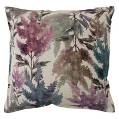 a pillow with purple and green flowers on it