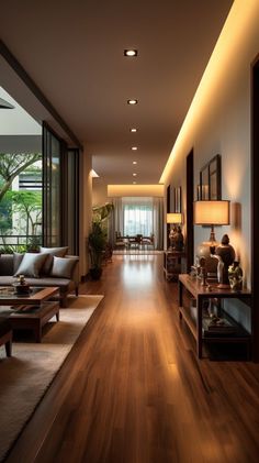 an empty living room with wood floors and large windows