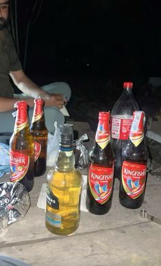 several bottles of beer are sitting on a table