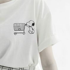 a person wearing a t - shirt with an image of a dog pushing a shopping cart