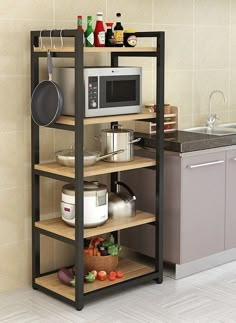 a microwave oven sitting on top of a wooden shelf next to a kitchen counter with pots and pans