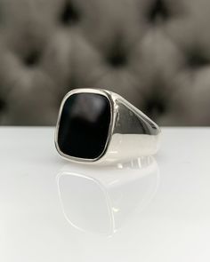 Men Ring with Onyx, Black Pinky Signet Ring, Square Shape Genuine Gemstone, Stylish Gold / Silver Ring, Handmade Jewelry, Best Gift for Him ◎ Details ◎ ○ Material 14K Solid Gold or 925 Sterling Silver Weight of Ring : approx 18.00 gr Height of Ring : approx 5.30 mm ○ Upgrade to Solid 18K Gold, please click the link below: https://www.etsy.com/listing/962826004 ○ Gemstone Natural Onyx Gemstone approx. 15 mm x 15 mm 4.23 ct Made to Order HANDMADE ITEM ○ For Men Collection : https://etsy.me/2PmKJMW Classic White Gold Rings With Black Enamel, Formal Onyx Open Ring, Classic Onyx Rings For Promise, Classic Onyx Open Ring Jewelry, Classic Black Gemstone Ring, Classic Onyx Promise Ring, Classic White Gold Onyx Rings, Luxury Hallmarked Onyx Rings, Onyx Open Ring For Formal Occasions