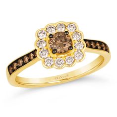 a yellow gold ring with brown and white diamonds