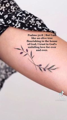 a woman's arm with a quote on it