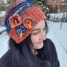 Bohemian style hat, crocheted flowers beanie, Knitted Flower Fairy Hat, Spring Hat Women, Hat color stripes. This is Various textures Hat with colorful stripes knitted from different yarns.  With a unique and funky design, this headwear is adorned with crocheted flowers complemented with beads. This one-of-a-kind Bohemian style hat is perfect for any season. The texture of the hat consists of both, embossed knitting and effect yarns, bouncy, and with fringes.  For my items I use Italian pure mer Winter Bohemian Yarn Bonnet, Bohemian Yarn Bonnet For Winter, Bohemian Winter Bonnet, Bohemian Knitted Beanie, Bohemian Knitted Beanie One Size, Bohemian Hand-knitted Crochet Hat, One Size, Bohemian Knitted Beanie Cap, Bohemian Beanie Crochet Hat, Bohemian Knitted Yarn Hats