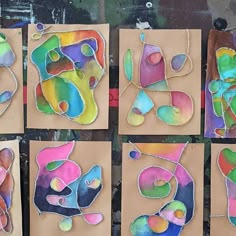 six pieces of paper with different shapes and sizes on them, all painted in various colors