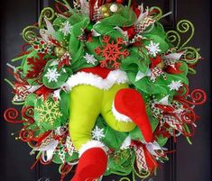 a christmas wreath is hanging on the front door