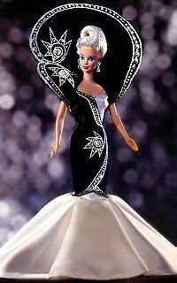 a barbie doll wearing a black and white dress