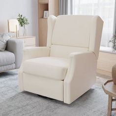 a white recliner chair sitting in a living room